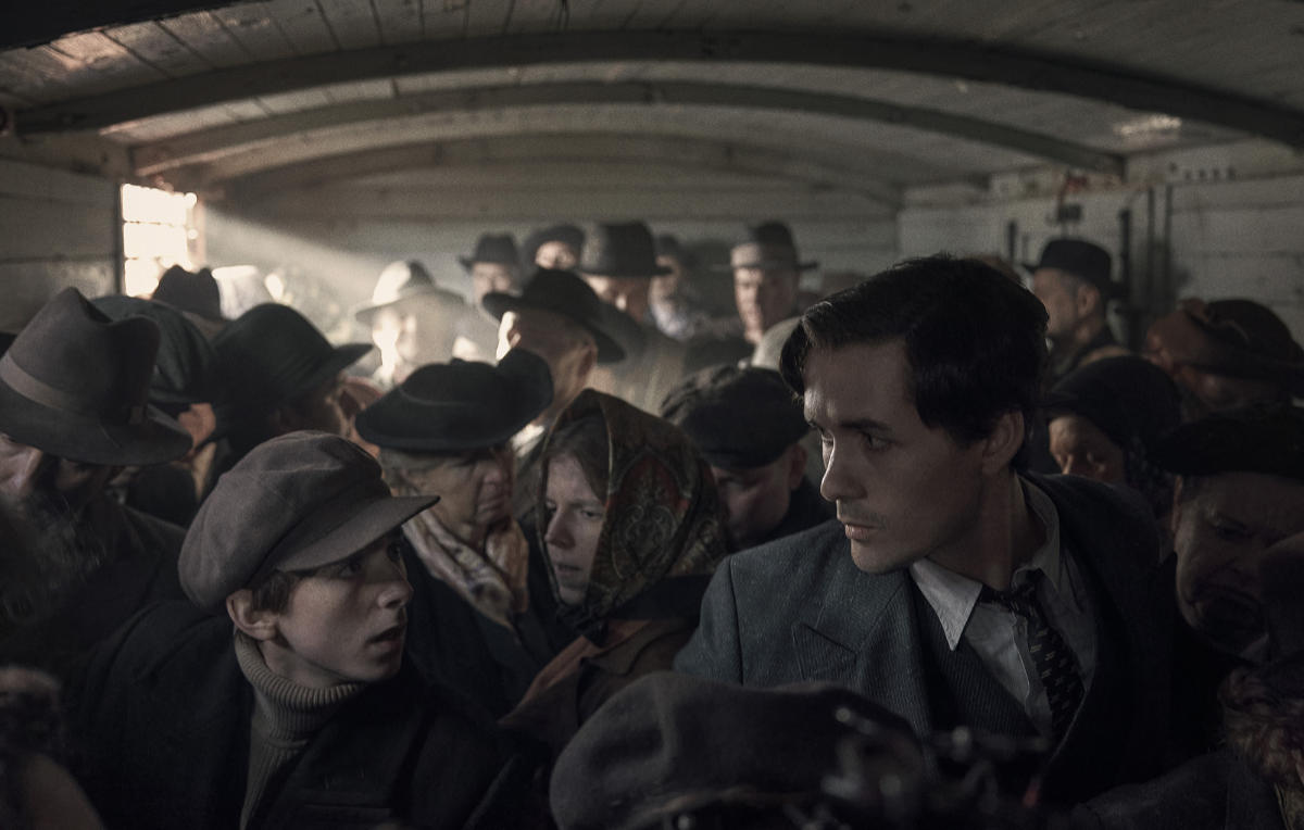 Jonah Hauer-King as Lali Sokolov, seen here as he boards the train to Auschwitz.