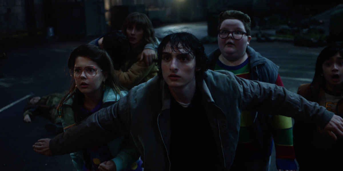 Winona Ryder as Joyce Byers, Finn Wolfhard as Mike Wheeler and Jake Connelly as Derek