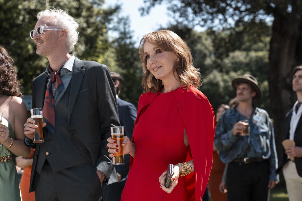 Bruno Gouery as Luc, Philippine Leroy-Beaulieu as Sylvie Grateau in Emily in Paris