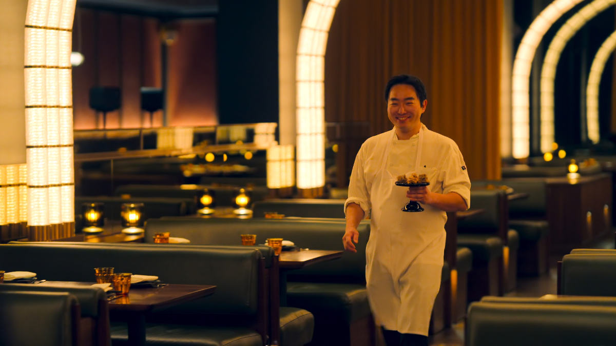 Coqodaq Executive Chef SK Kim presenting a dish