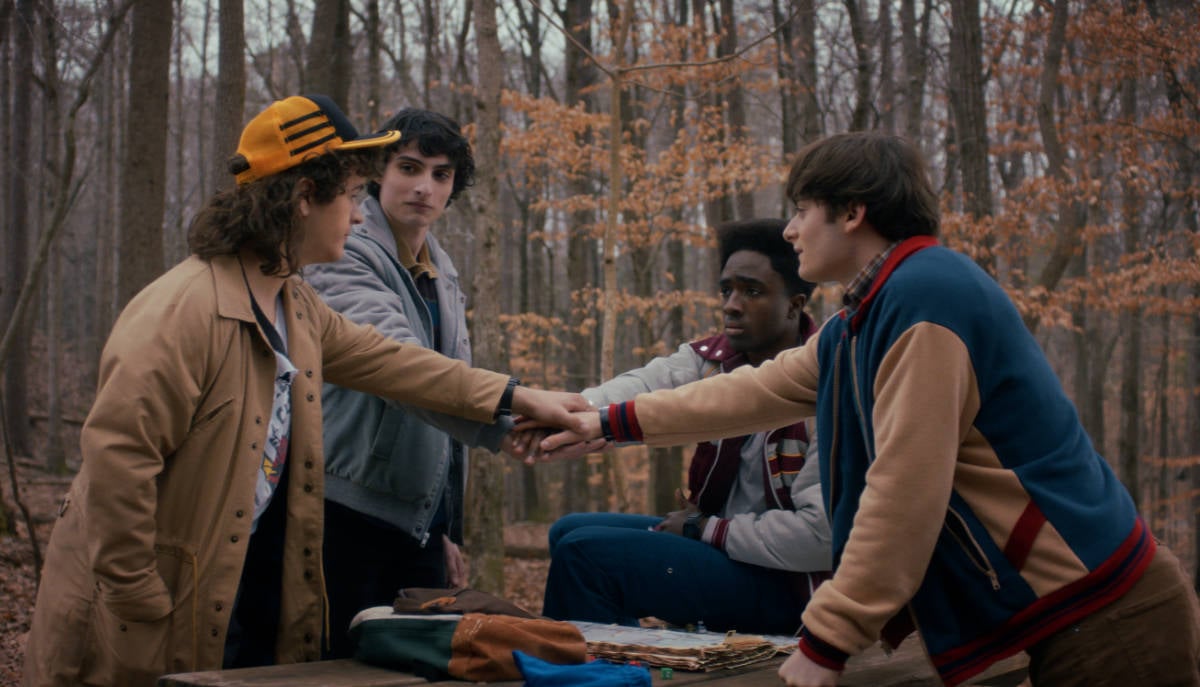 Gaten Matarazzo as Dustin Henderson, Finn Wolfhard as Mike Wheeler, Caleb McLaughlin as Lucas Sinclair, and Noah Schnapp as Will Byers