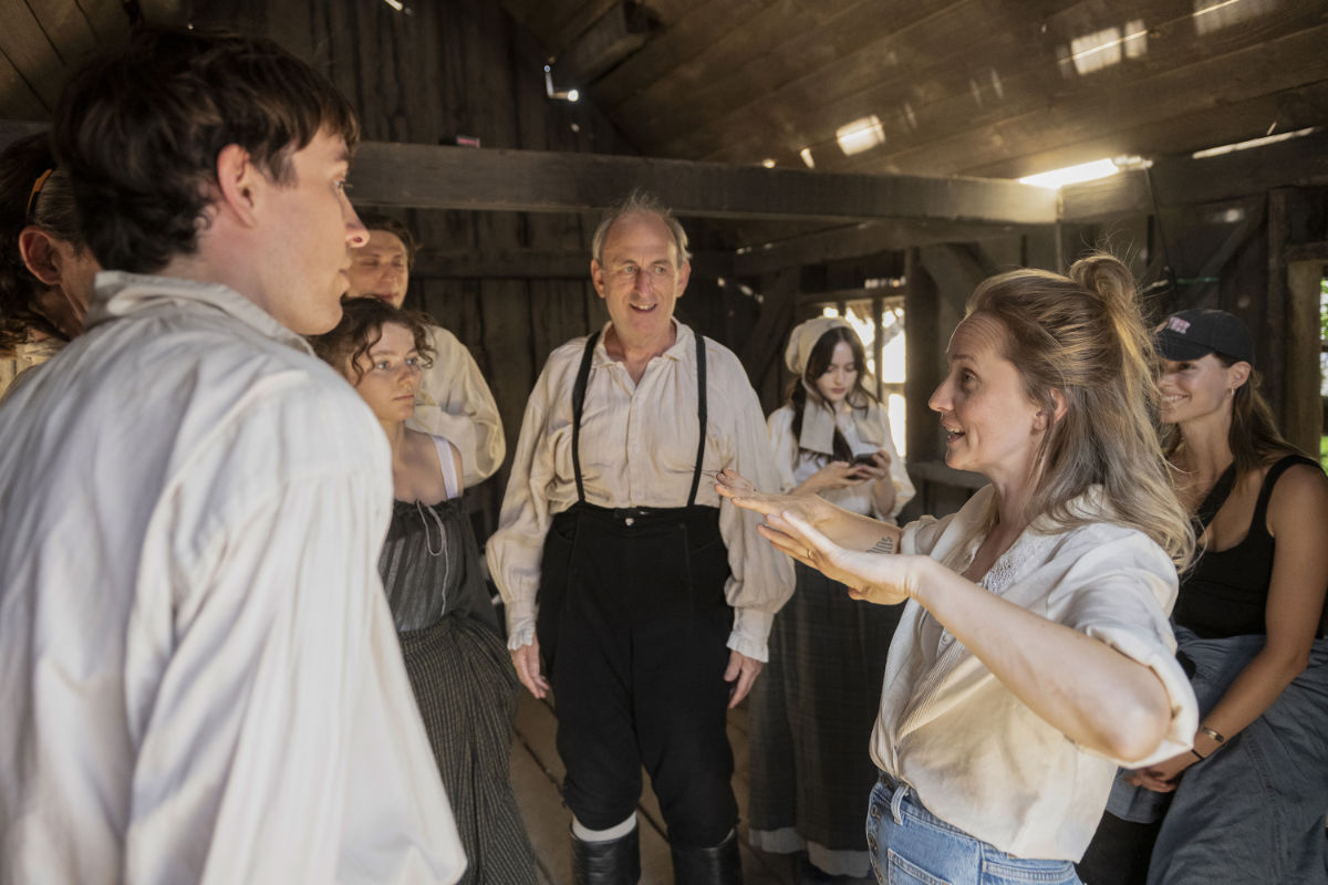 Mona Fastvold with cast and crew