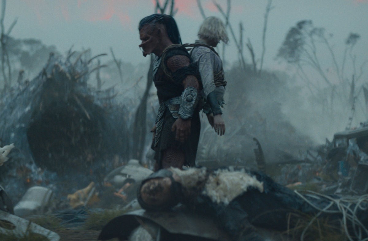 Dek (Dimitrius Schuster-Koloamatangi) and Thia (Elle Fanning) in Predator: Badlands