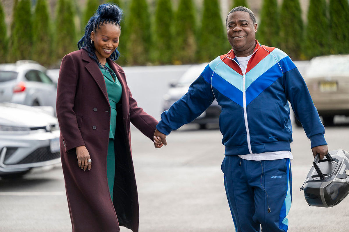 Erika Alexander as Monica, Tracy Morgan as Reggie Dinkins