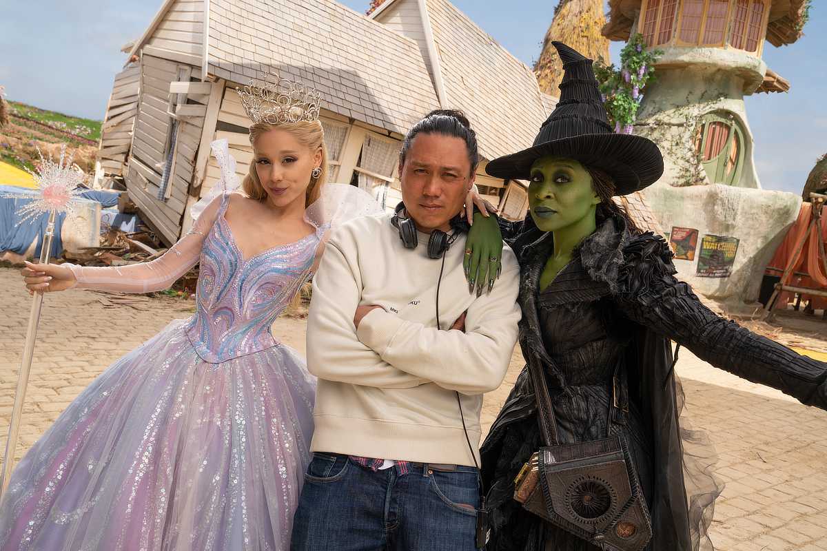 Ariana Grande (as Glinda), Director Jon M. Chu, and Cynthia Erivo (as Elphaba)