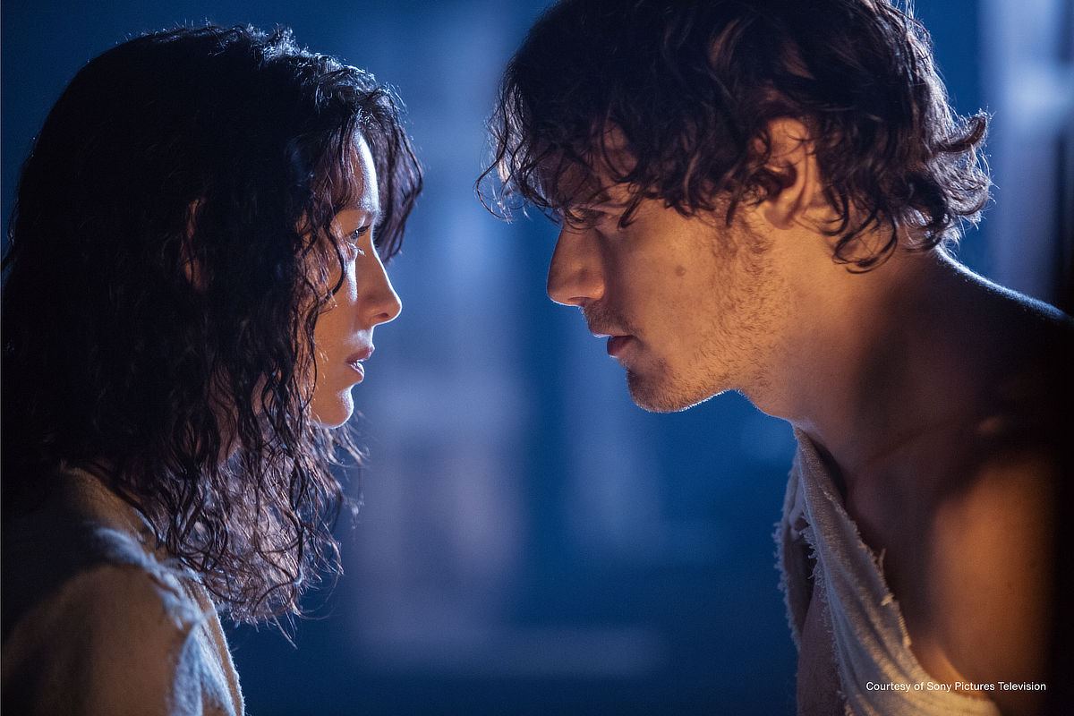 Caitríona Balfe as Claire Fraser and Sam Heughan as Jamie Fraser