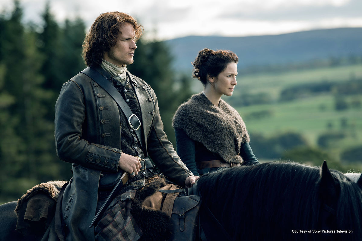 Caitríona Balfe as Claire Fraser and Sam Heughan as Jamie Fraser