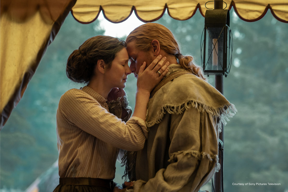 Caitríona Balfe as Claire Fraser and Sam Heughan as Jamie Fraser