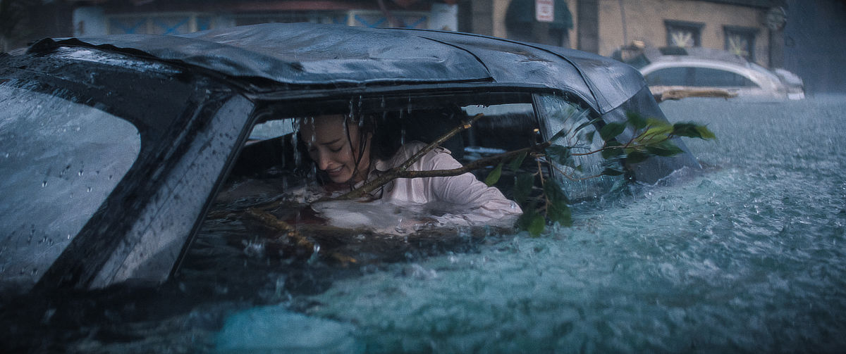 Phoebe Dynevor trapped in a car in a flood