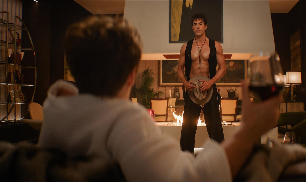 Fiona Shaw as Felicity Chase and Sacha Baron Cohen as Damien Sachs