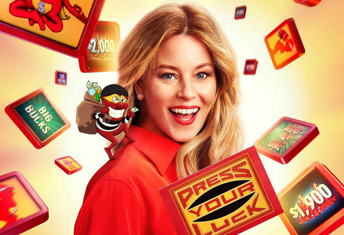 Elizabeth Banks in a red shirt as host of Press Your Luck