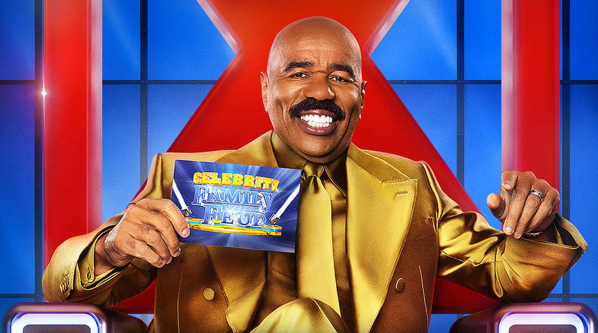 Steve Harvey in a gold suit as host of Celebrity Family Feud