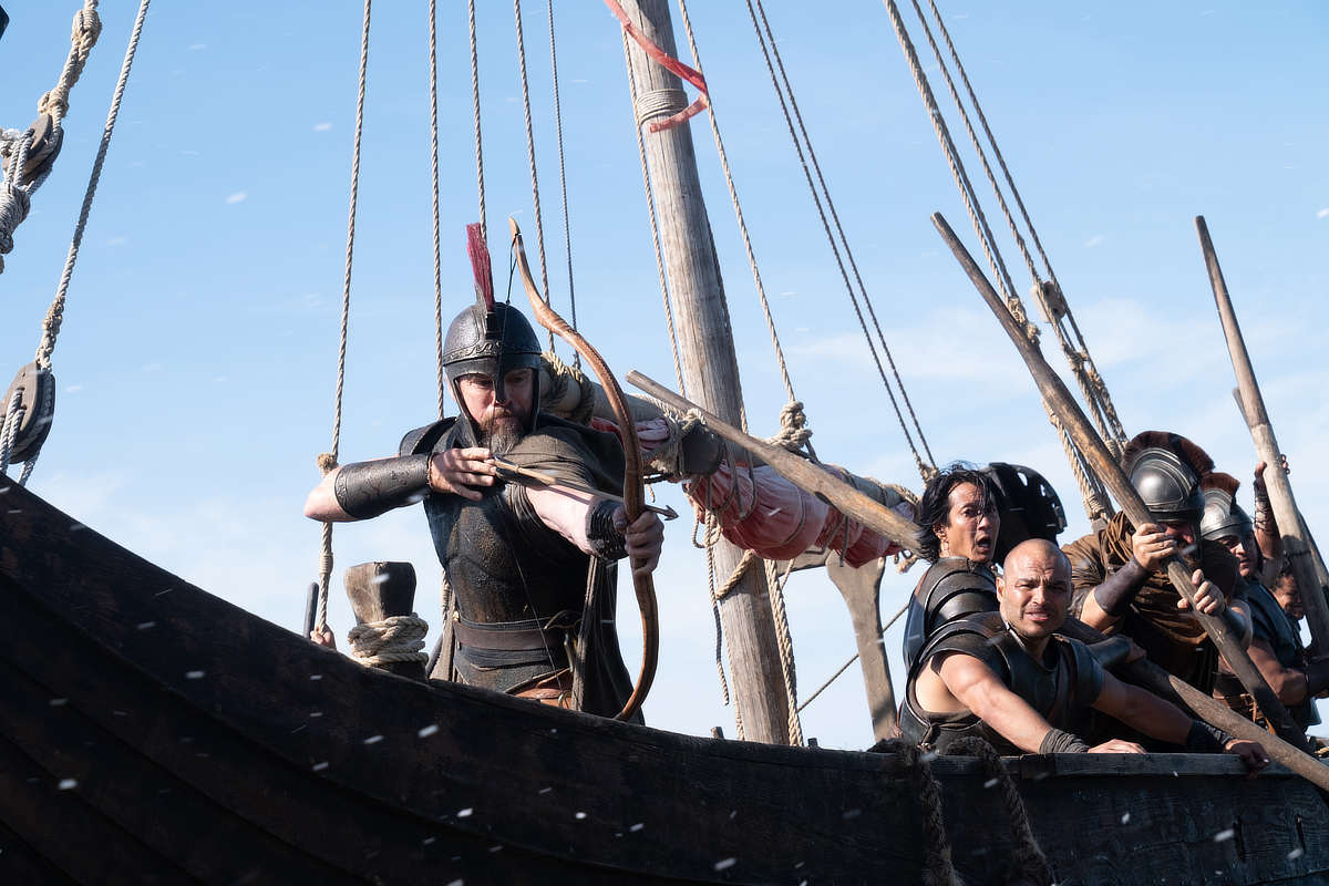 Matt Damon (frame left, with bow) is Odysseus