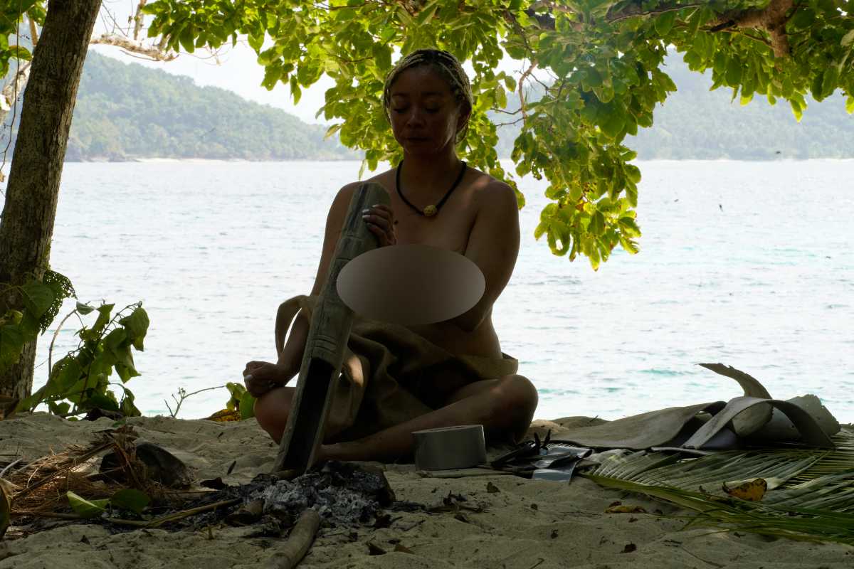 Malu working with driftwood