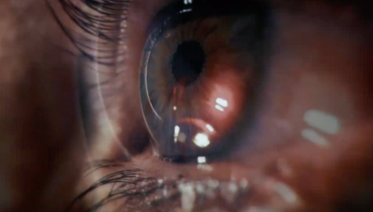Close-up of an eye reflecting a light