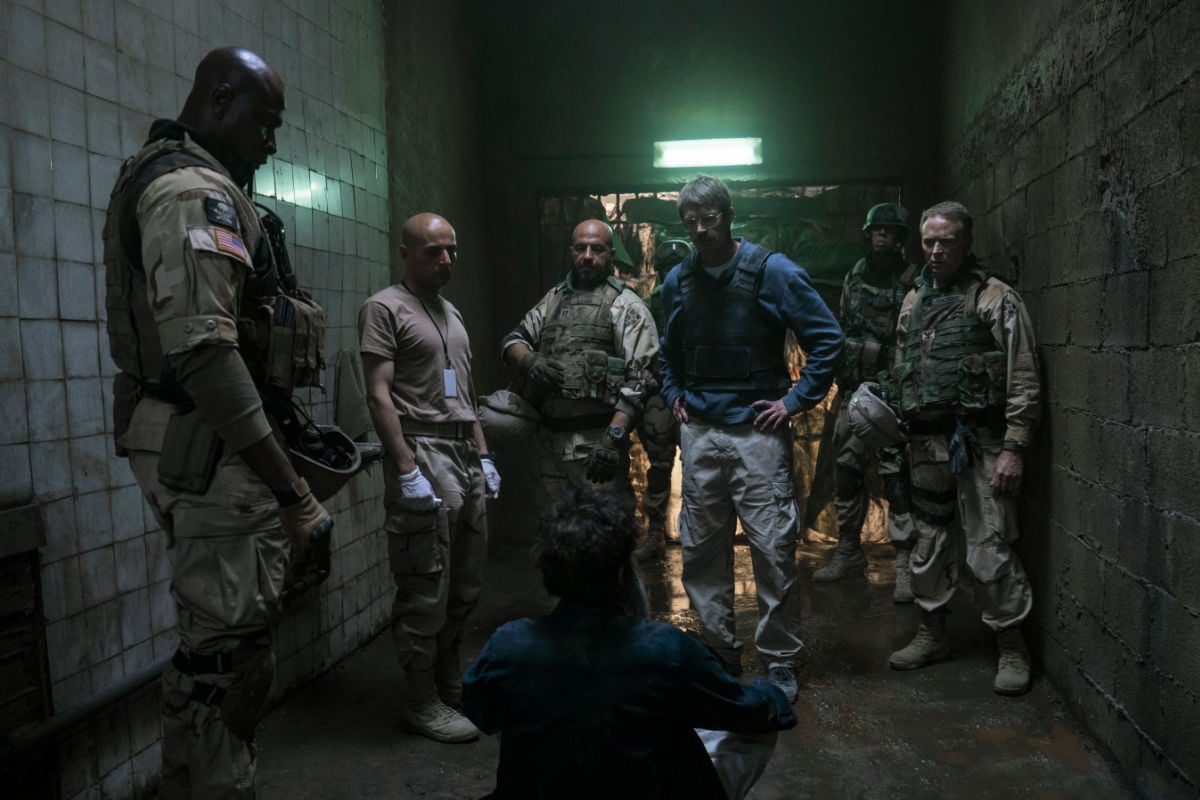 John Nixon (Joel Kinnaman) and Saddam Hussein (Waleed Zuaiter)