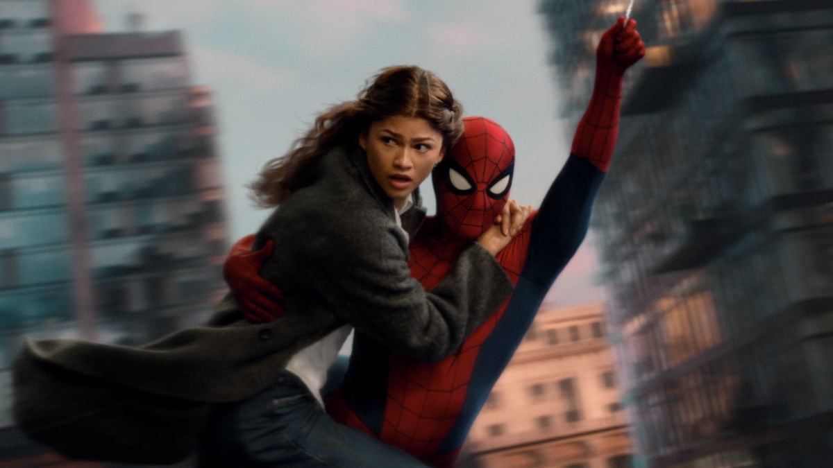 MJ (Zendaya) swings through the city with Spider-Man