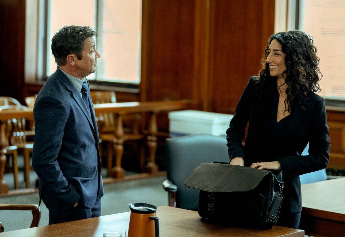 Jeremy Renner as Mike McLusky and Necar Zadegan as Evelyn