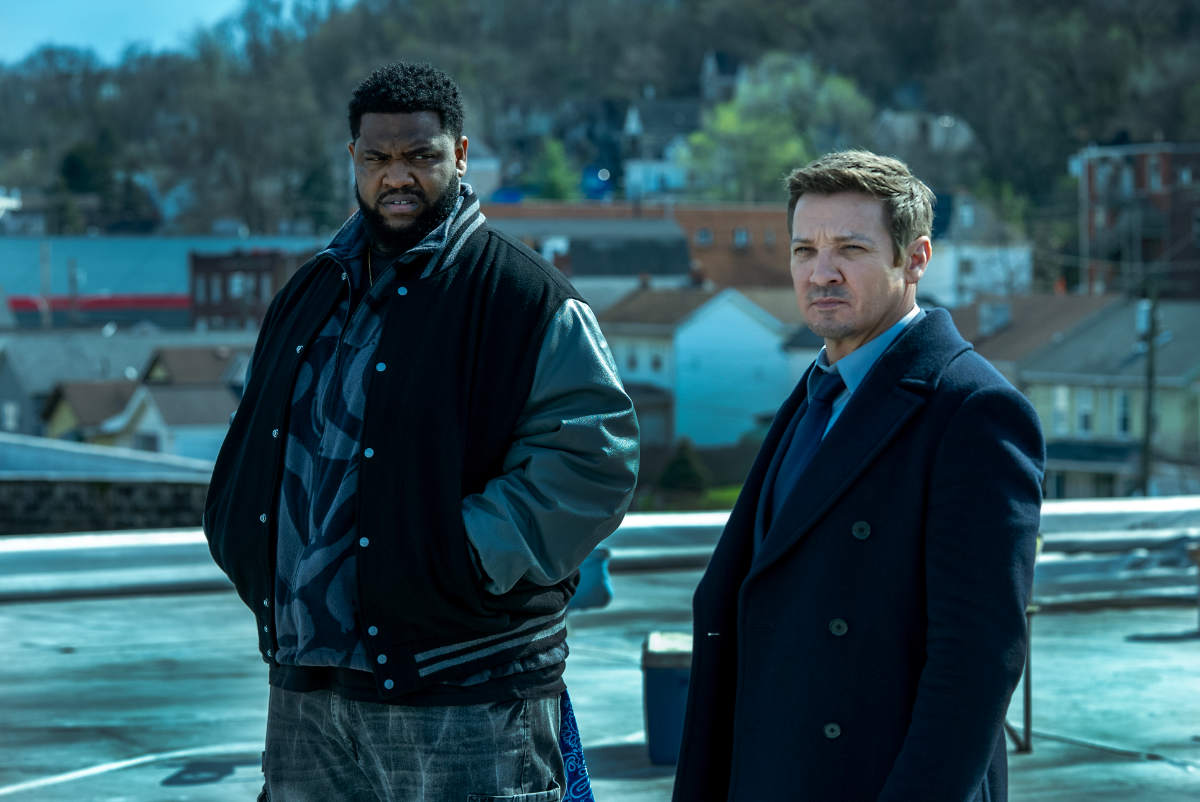 Tobi Bamtefa as Deverin "Bunny" Washington and Jeremy Renner as Mike McLusky